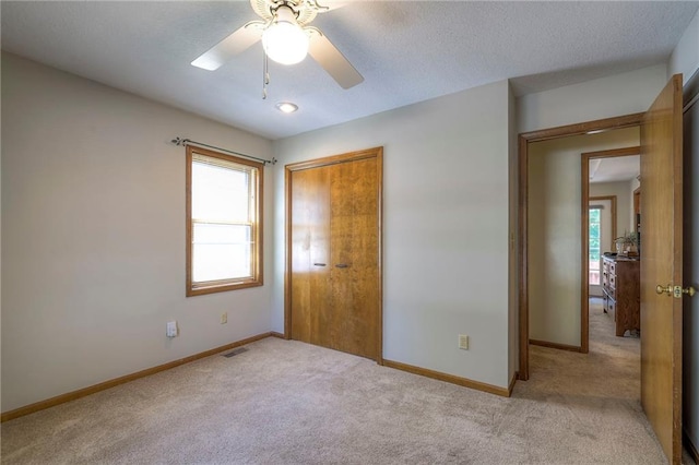3812 SW Windemere Dr, Lees Summit, MO 64082 - unfurnished bedroom with carpet flooring, multiple windows, a closet, and a ceiling fan
