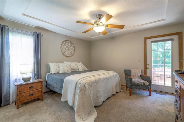3812 SW Windemere Dr, Lees Summit, MO 64082 - bedroom with multiple windows, light colored carpet, and access to exterior