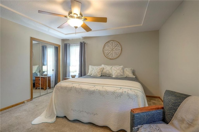 3812 SW Windemere Dr, Lees Summit, MO 64082 - bedroom with light colored carpet, a tray ceiling, and a closet
