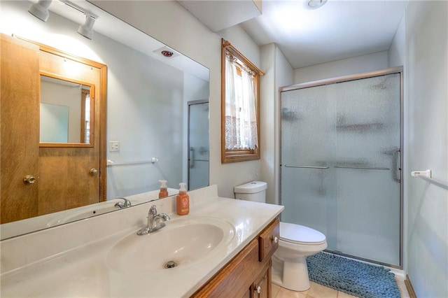 3812 SW Windemere Dr, Lees Summit, MO 64082 - bathroom featuring a shower stall, vanity, and tile patterned floors