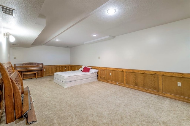 3812 SW Windemere Dr, Lees Summit, MO 64082 - game room with light carpet, a textured ceiling, a wainscoted wall, and recessed lighting