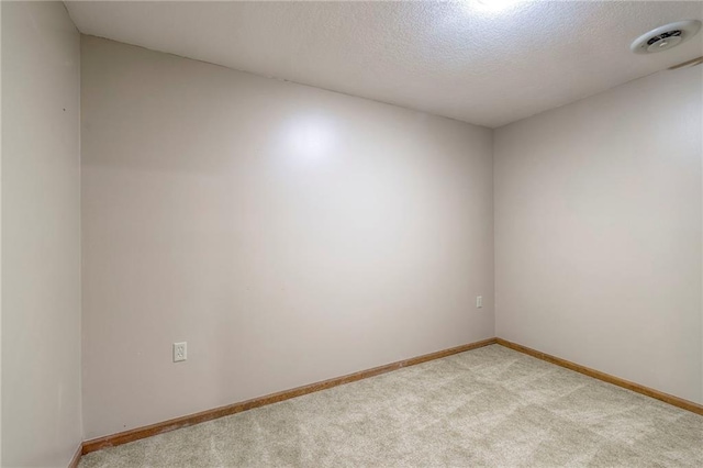 3812 SW Windemere Dr, Lees Summit, MO 64082 - spare room featuring light colored carpet and a textured ceiling
