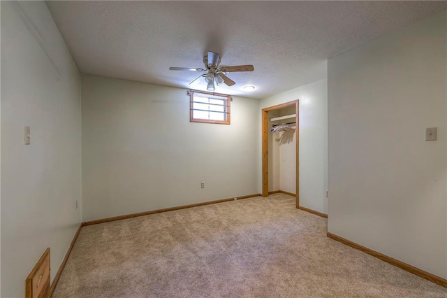 3812 SW Windemere Dr, Lees Summit, MO 64082 - unfurnished bedroom with light colored carpet, a textured ceiling, ceiling fan, and a closet