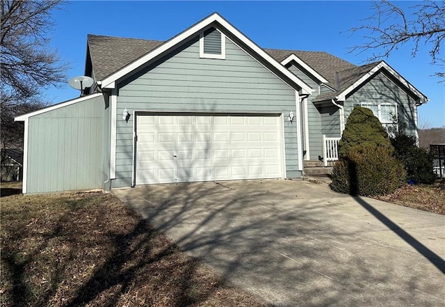 view of side of property with a garage