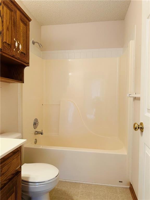 full bathroom with shower / bathtub combination, vanity, toilet, and a textured ceiling