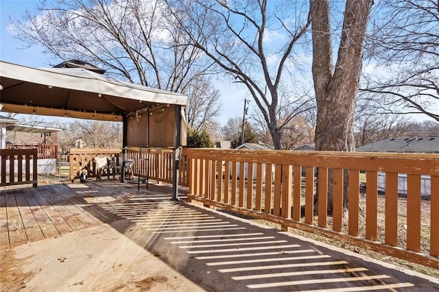 wooden deck featuring a gazebo