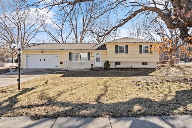 split level home with a garage and concrete driveway