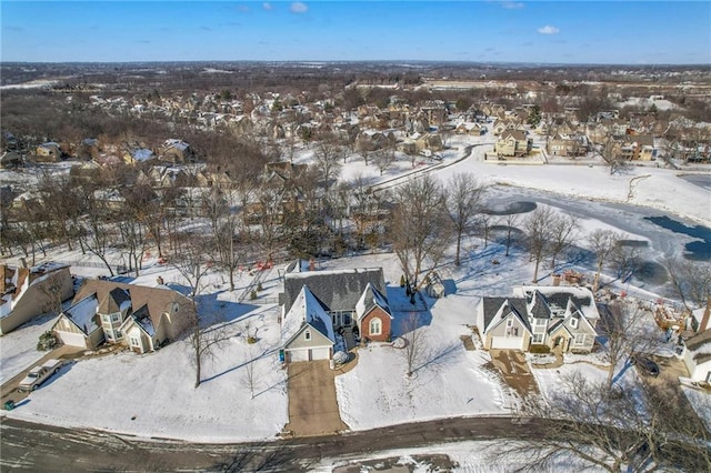 snowy aerial view featuring a residential view