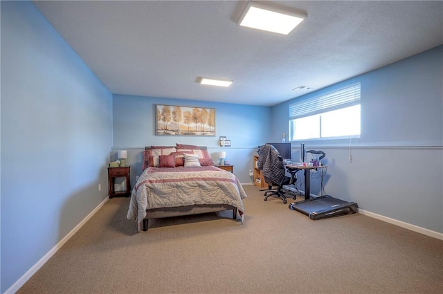 bedroom featuring carpet floors, visible vents, and baseboards