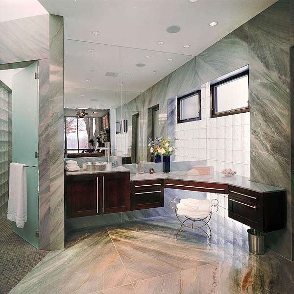 bathroom with vanity and tile walls