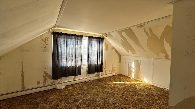 bonus room featuring a baseboard radiator, carpet flooring, and vaulted ceiling