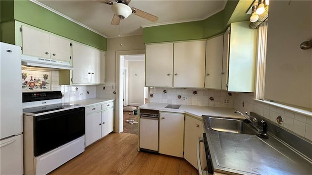 kitchen featuring freestanding refrigerator, a sink, ceiling fan, electric stove, and under cabinet range hood