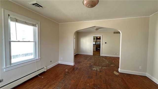 spare room featuring visible vents, crown molding, baseboard heating, wood finished floors, and arched walkways