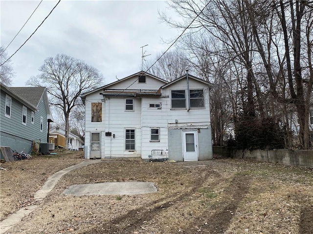 back of house with central AC