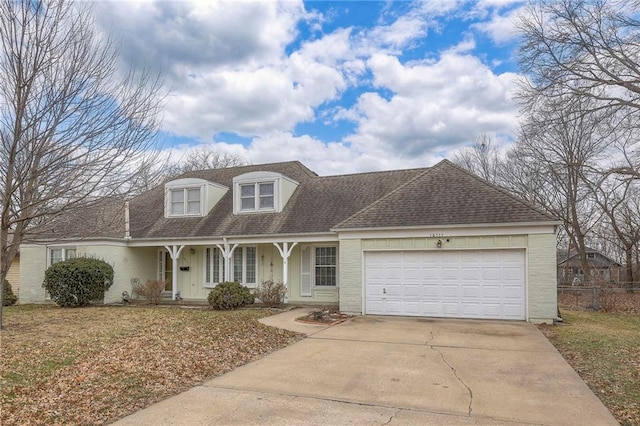 10111 E 86th Ter, Raytown, MO 64138 - cape cod house featuring a garage
