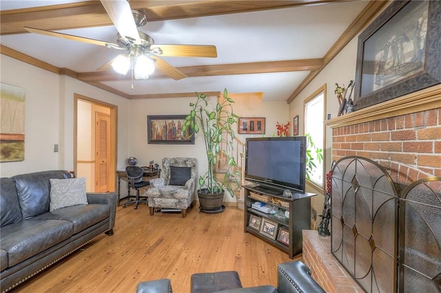 10111 E 86th Ter, Raytown, MO 64138 - living room featuring hardwood / wood-style flooring, a fireplace, crown molding, and ceiling fan