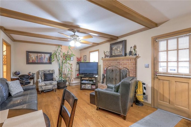 10111 E 86th Ter, Raytown, MO 64138 - living room featuring beamed ceiling, a healthy amount of sunlight, and light wood-type flooring