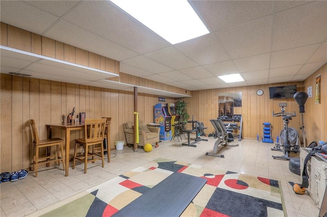 10111 E 86th Ter, Raytown, MO 64138 - exercise area featuring a drop ceiling and wood walls