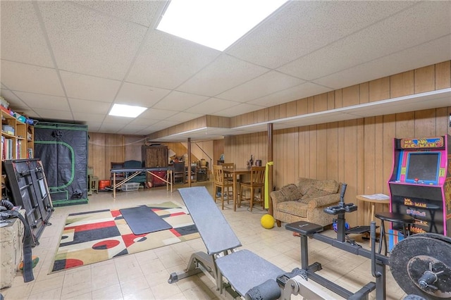 10111 E 86th Ter, Raytown, MO 64138 - exercise room featuring a paneled ceiling and wood walls