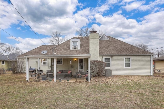 10111 E 86th Ter, Raytown, MO 64138 - rear view of house featuring outdoor lounge area, a yard, cooling unit, and a patio area