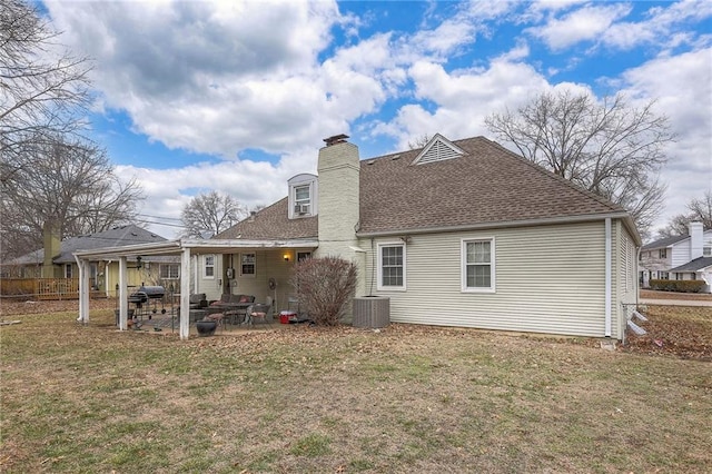 10111 E 86th Ter, Raytown, MO 64138 - rear view of property with a yard, central AC, and a patio