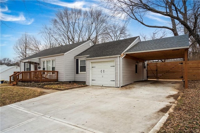 view of home's exterior with a garage, a deck, and a carport