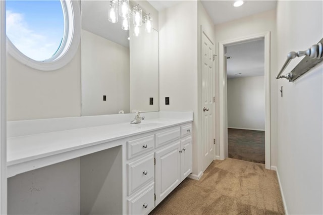 bathroom featuring baseboards and vanity