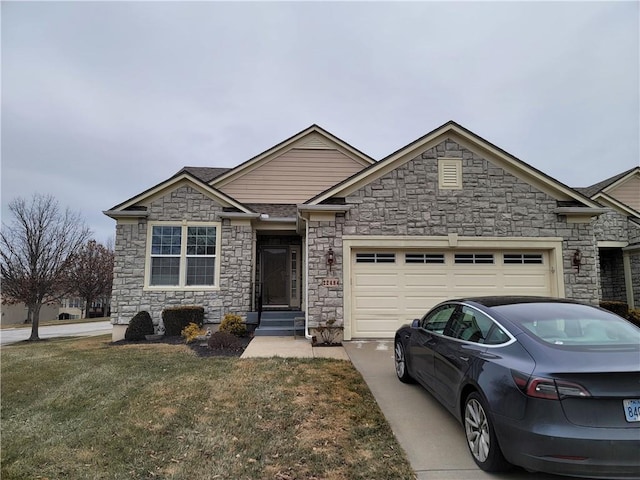 view of front of home featuring a garage and a front lawn