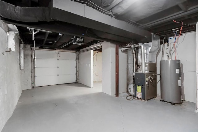 garage featuring heating unit, a garage door opener, and water heater