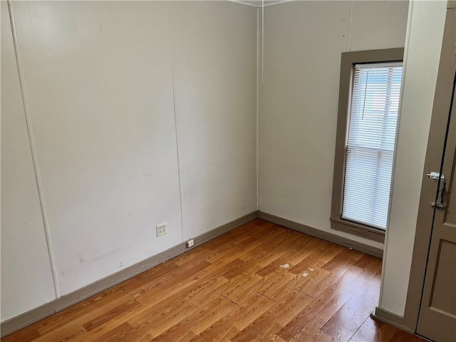 spare room featuring light hardwood / wood-style flooring