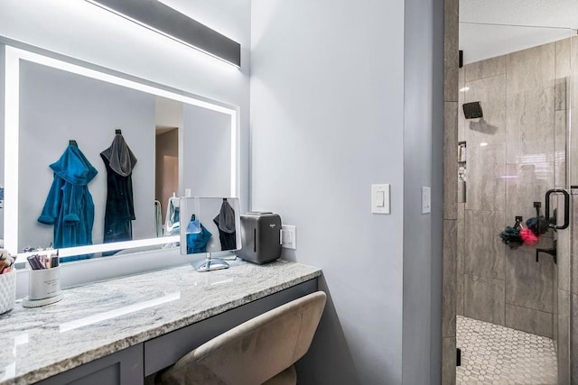 bathroom featuring vanity and walk in shower