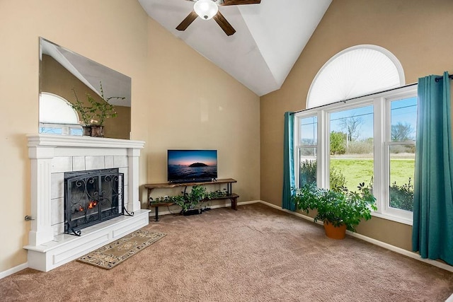 carpeted living area featuring high vaulted ceiling, a fireplace, a ceiling fan, and baseboards