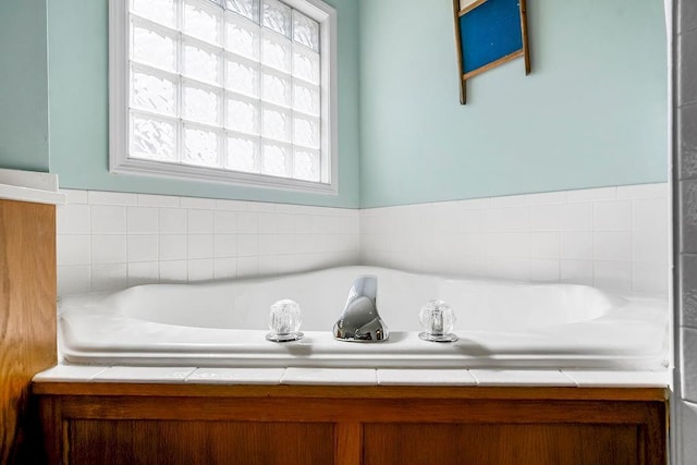 bathroom with a garden tub