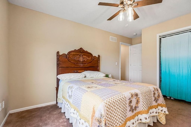 bedroom with baseboards, visible vents, carpet floors, ceiling fan, and a closet