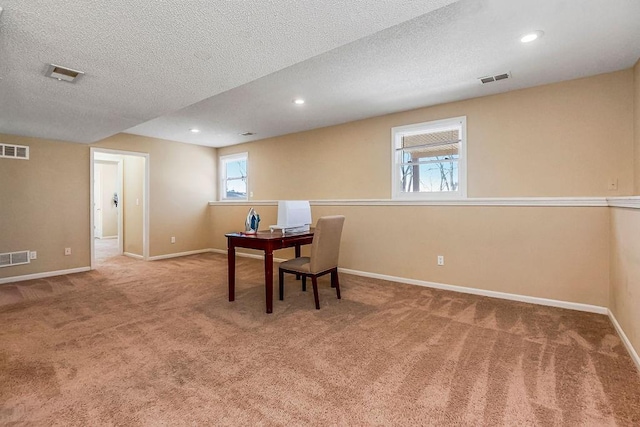 carpeted office space with visible vents, recessed lighting, and baseboards