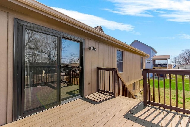 deck featuring a lawn