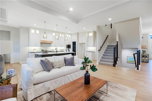 12505 W 184th St, Overland Park, KS 66013 - living area featuring recessed lighting, stairway, and light wood-style flooring