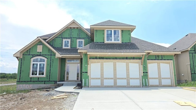 12505 W 184th St, Overland Park, KS 66013 - view of front of property with a shingled roof and concrete driveway