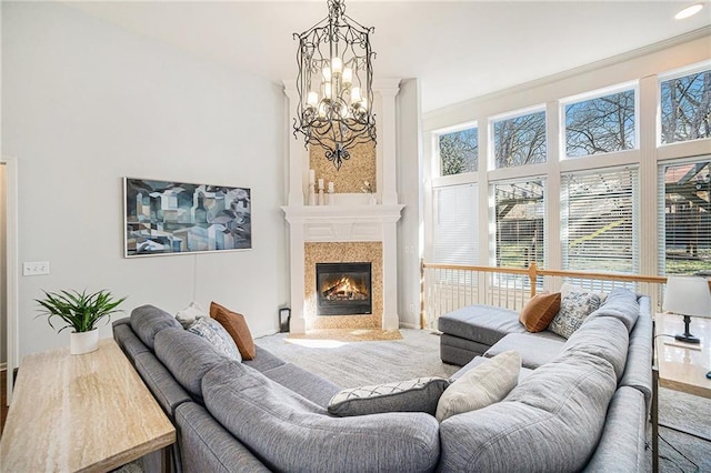 carpeted living area featuring a high end fireplace