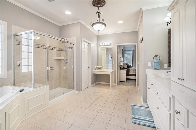 full bathroom featuring tile patterned flooring, crown molding, vanity, and a stall shower