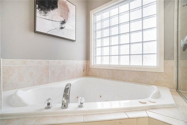 full bathroom featuring a whirlpool tub