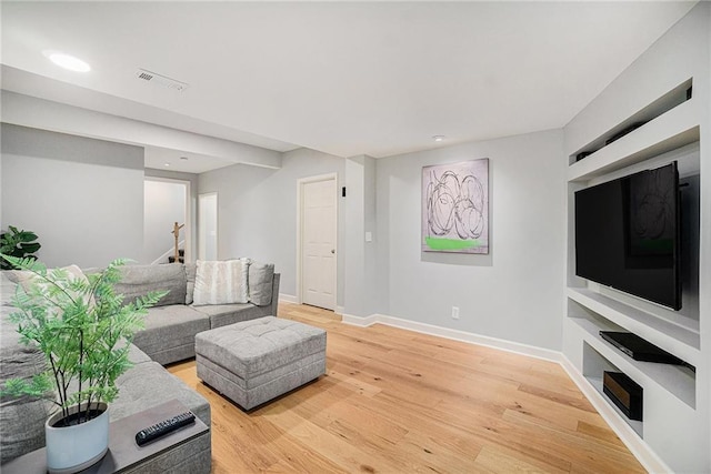 living area featuring visible vents, recessed lighting, stairway, light wood finished floors, and baseboards