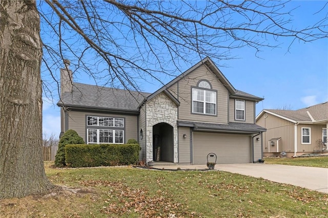 view of front facade featuring a garage and a front lawn