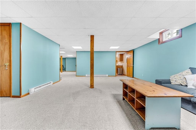 below grade area featuring carpet, a baseboard radiator, and baseboards