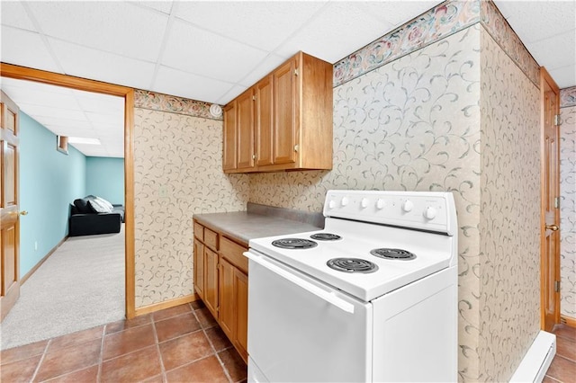 kitchen featuring a drop ceiling, carpet floors, baseboards, white range with electric cooktop, and wallpapered walls