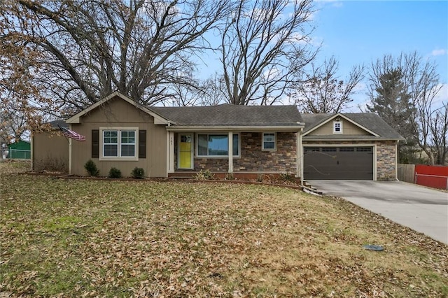 single story home featuring a garage and a front lawn