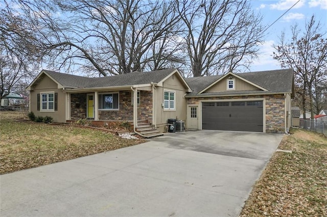 single story home featuring a garage and a front yard