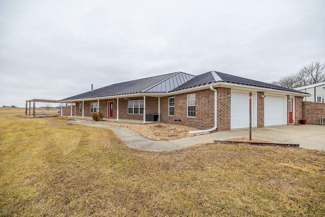 single story home featuring a garage and a front lawn