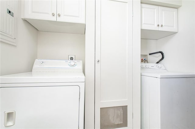 clothes washing area with cabinet space and washing machine and clothes dryer