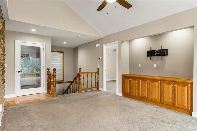 unfurnished room with ceiling fan, baseboards, light colored carpet, vaulted ceiling, and recessed lighting